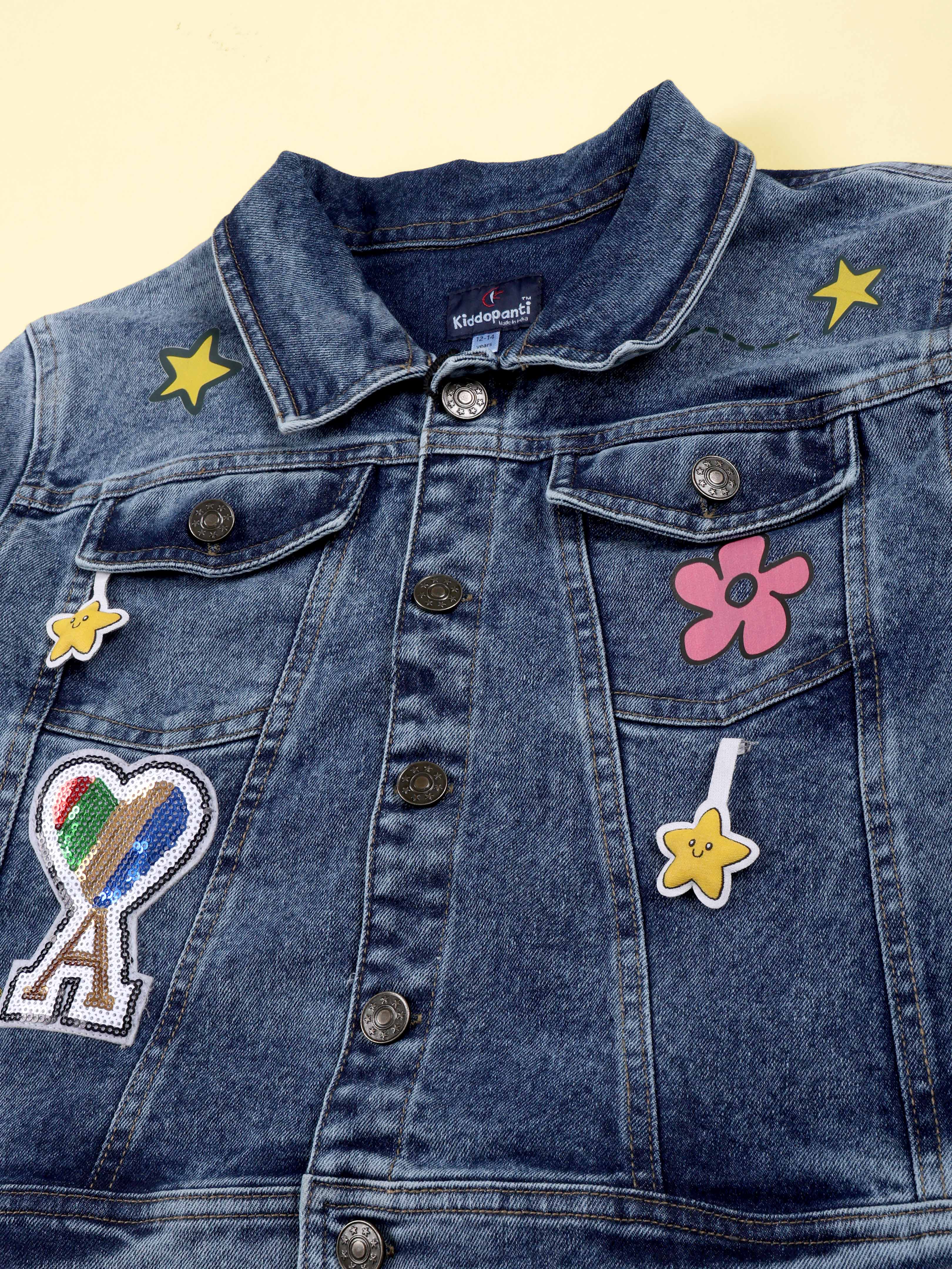 Kiddopanti Girls Denim Woven Multi Star Printed and Badges Crop Jacket