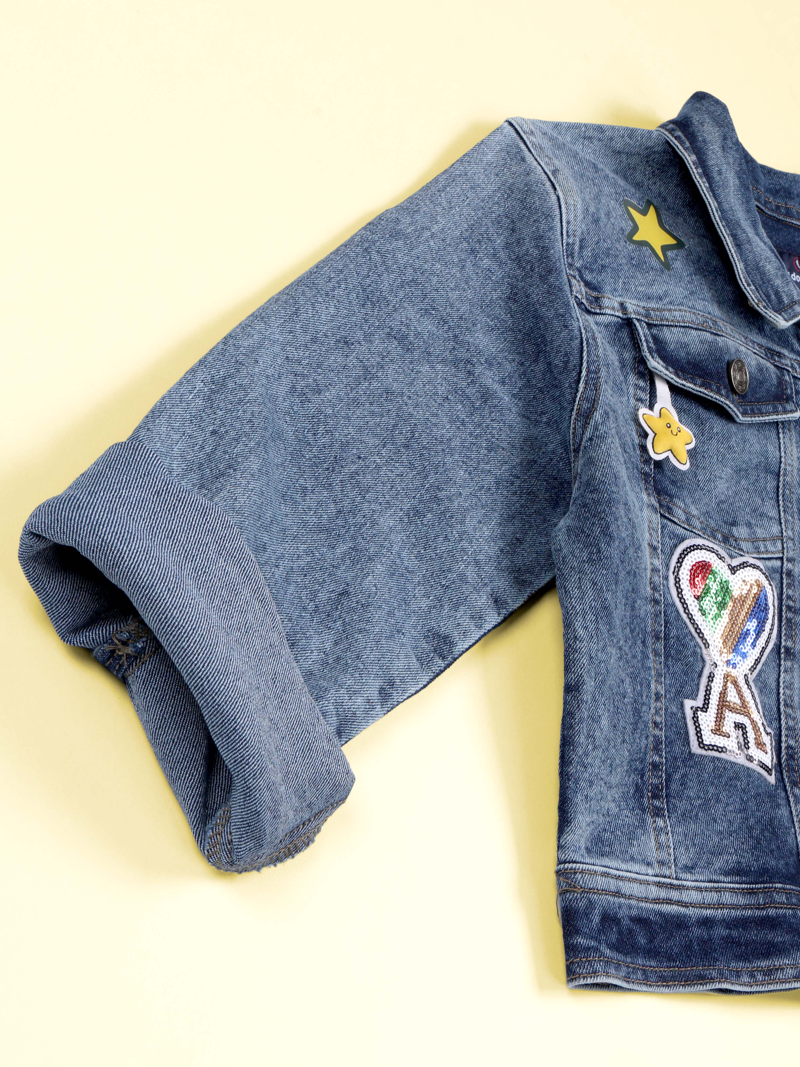 Kiddopanti Girls Denim Woven Multi Star Printed and Badges Crop Jacket