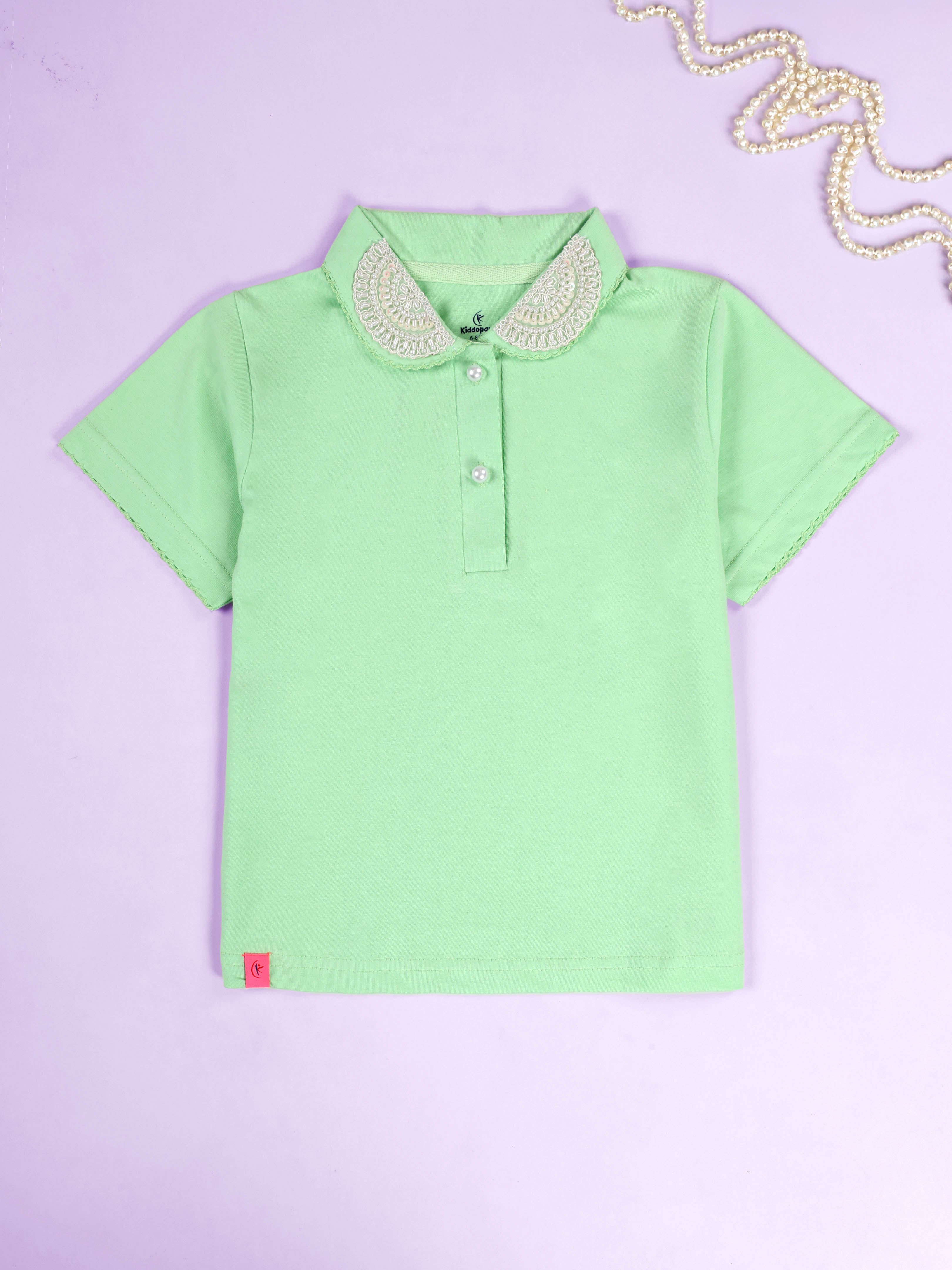 Kiddopanti Girls Solid Polo Tee With Cotton Over Lap Skort With Flowers and Pearls Set