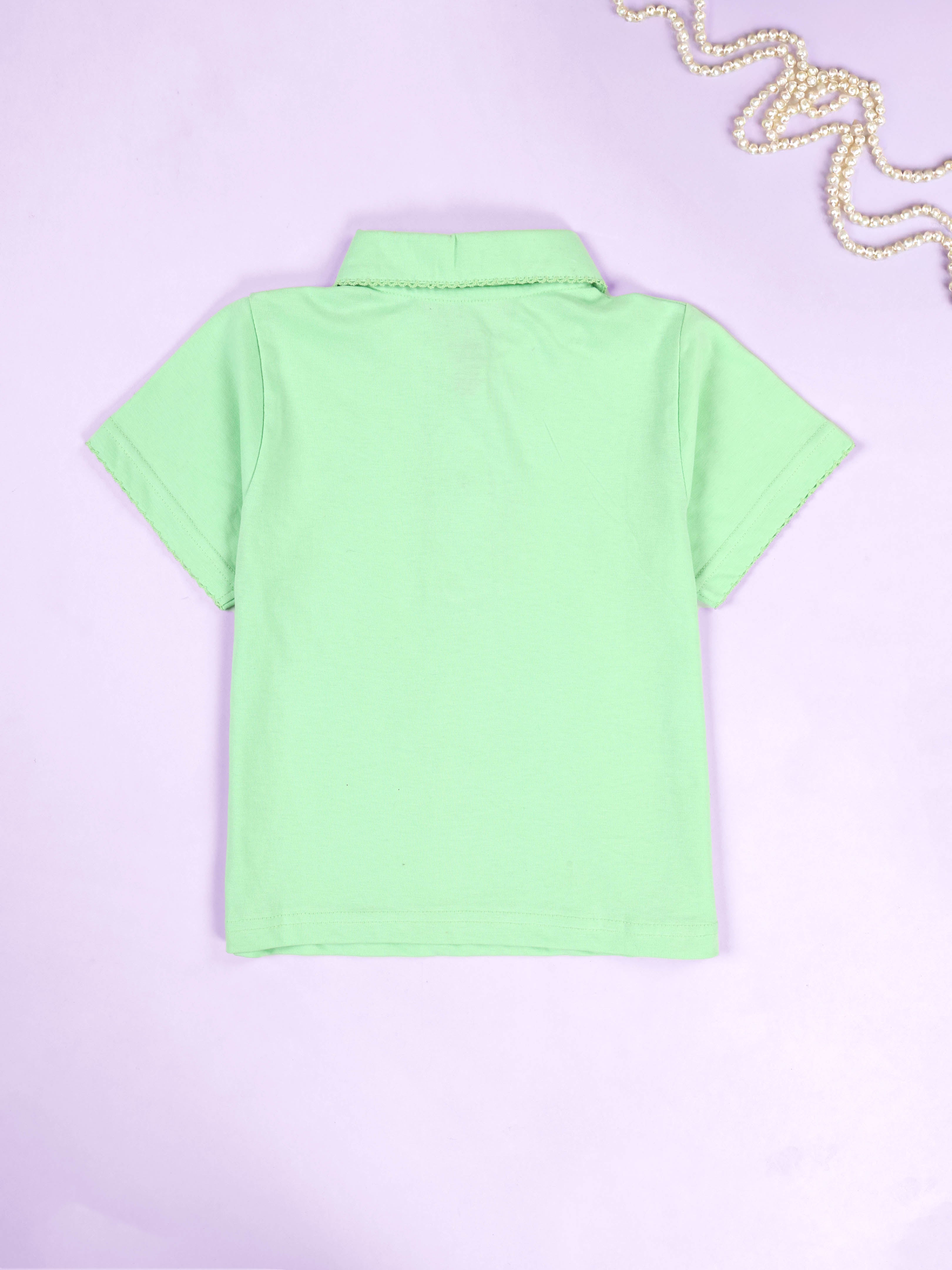 Kiddopanti Girls Solid Polo Tee With Cotton Over Lap Skort With Flowers and Pearls Set