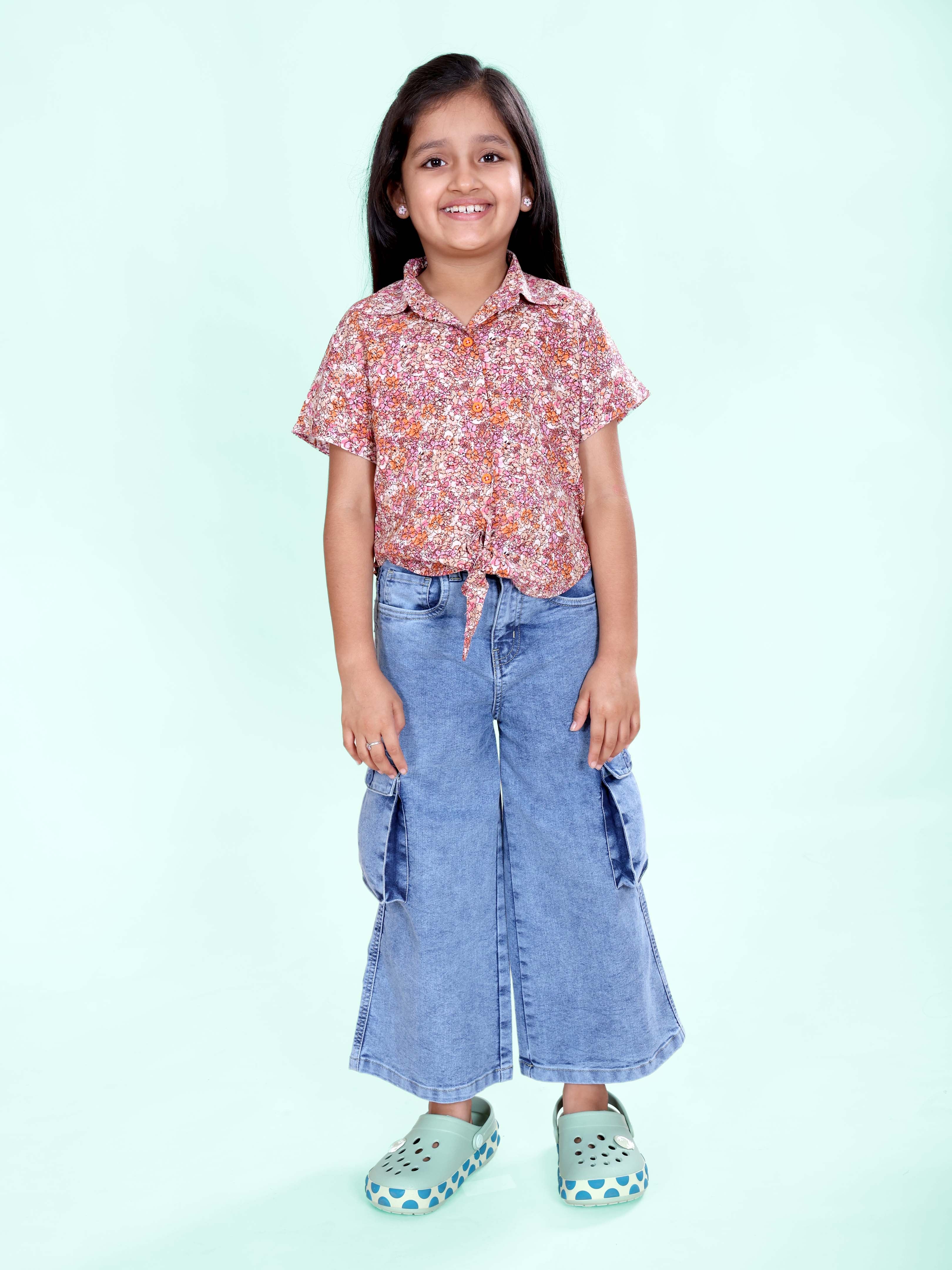 Girls Rayon Woven Half Sleeves Floral Printed Front Knot Tie Up Shirt & Denim Woven Flared Solid Utility Cargo Jeans Co Ord Set