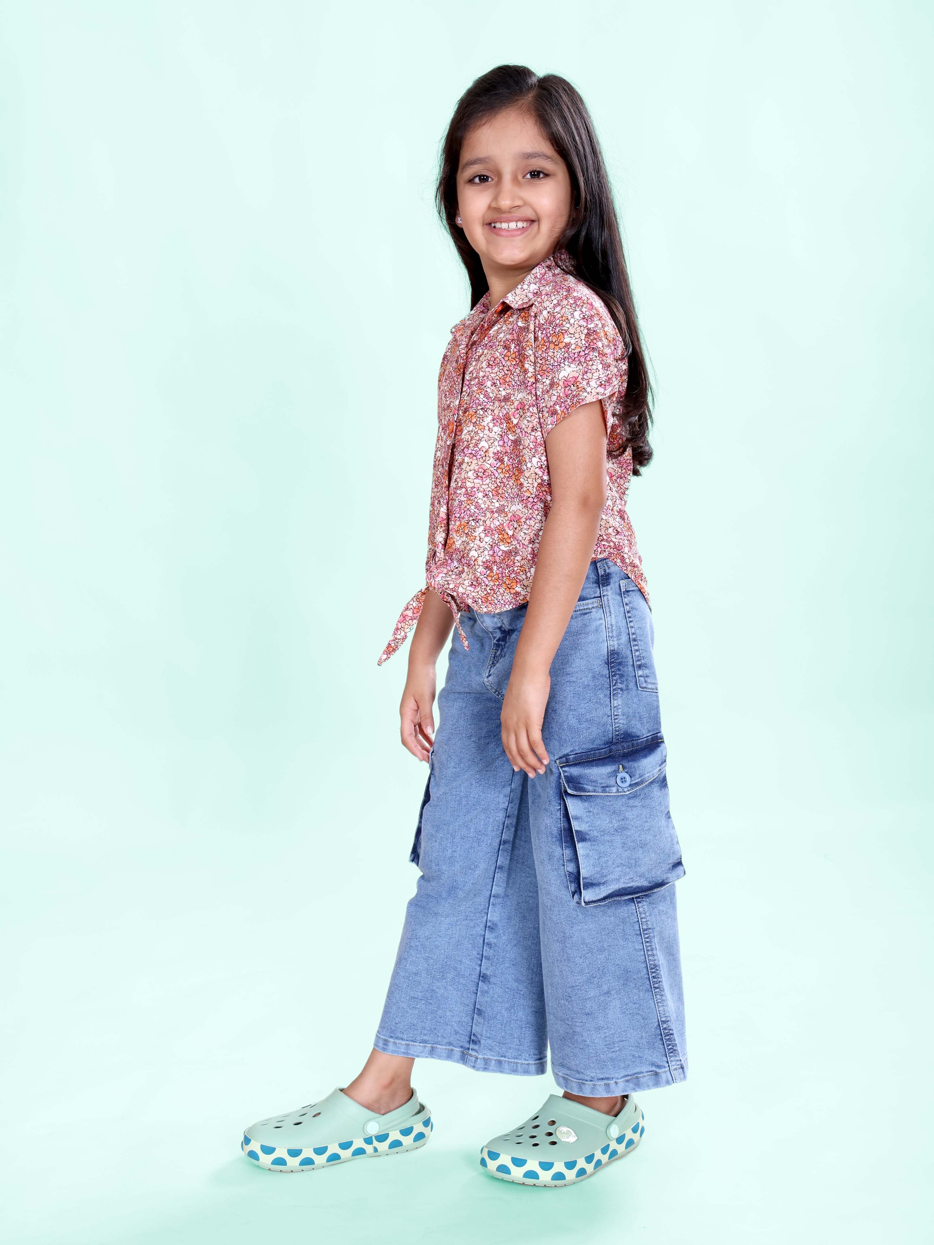 Girls Rayon Woven Half Sleeves Floral Printed Front Knot Tie Up Shirt & Denim Woven Flared Solid Utility Cargo Jeans Co Ord Set