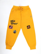 KiddoPanti 100% Cotton Printed Track Pant with Badges - Mustard With Multi Badge / 3-4Y